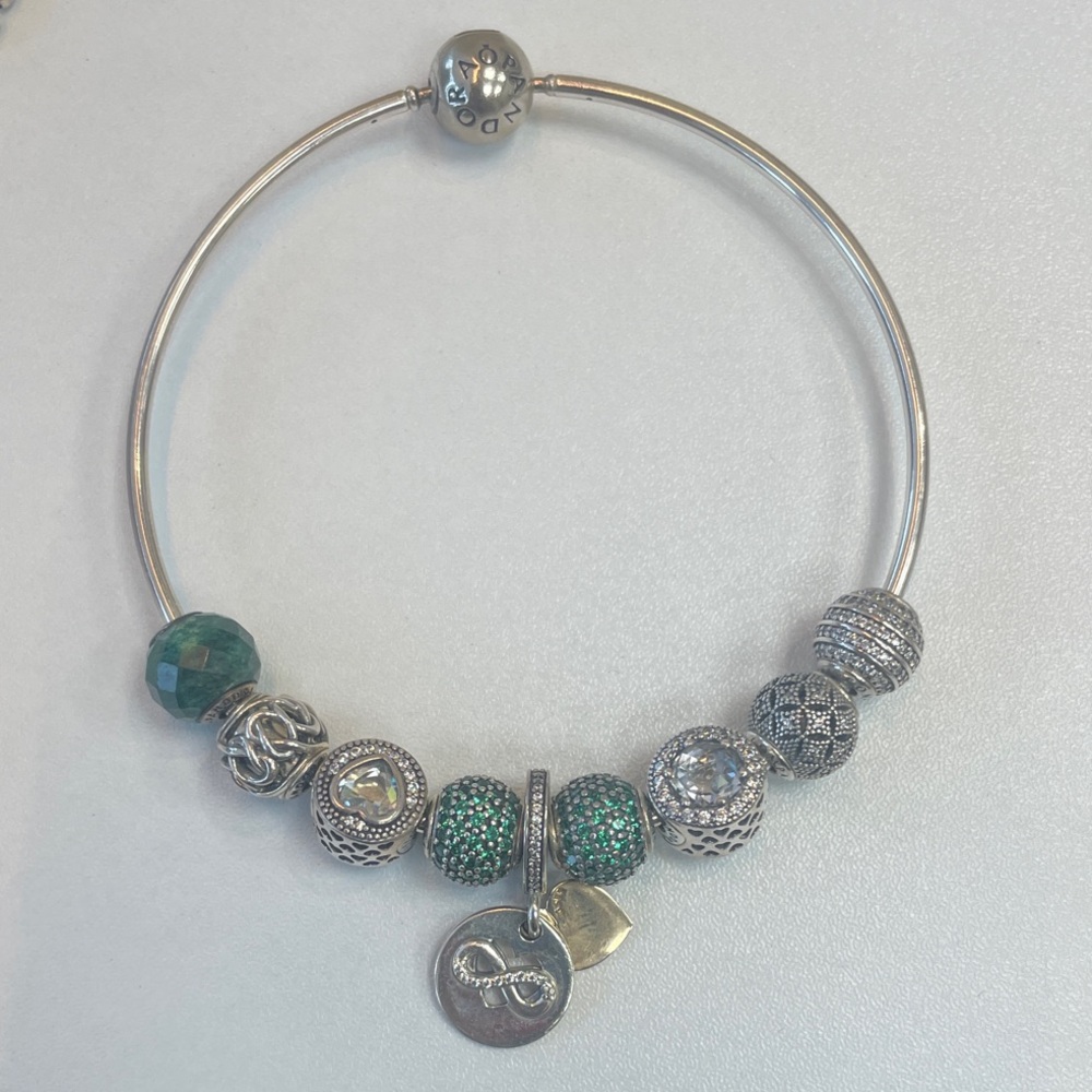 Pandora Essence bracelet with green and silver charms